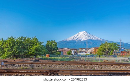 Kawaguchiko Railroad Tracks With Mount Fuji  In Summer