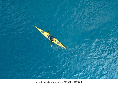 Kayak boat blue turquoise water sea, sunny day. Concept banner travel, aerial top view. - Powered by Shutterstock