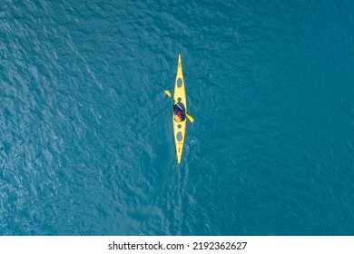 Kayak boat blue turquoise water sea, sunny day. Concept banner travel, aerial top view. - Powered by Shutterstock