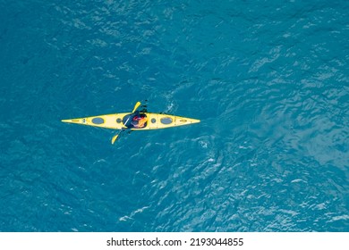 Kayak boat blue turquoise water sea, sunny day. Concept banner travel, aerial top view. - Powered by Shutterstock