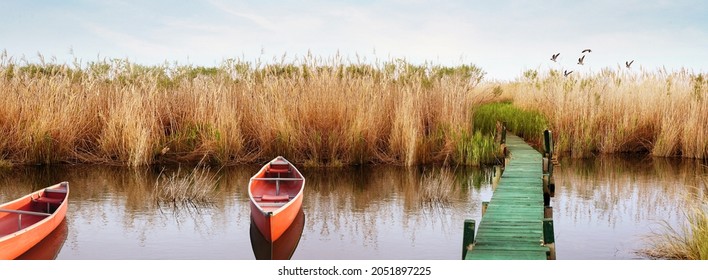 Kayak or canoe on a water front in the lake. Outdoors and adventure concept. vintage style.  - Shutterstock ID 2051897225