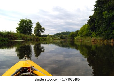 Kayak nose on the background of picturesque nature. Rowing in a yellow kayak in summer along the trees at the bank of Seversky Donets river. - Powered by Shutterstock