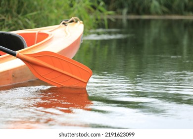 Kayak Oar Reflect In Water Surface Close-up. River Kayaking In Summer Day Concept. Active Vacations.