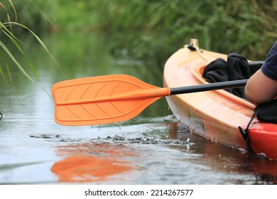 Kayak Oar With Water Drops Close-up. River Kayaking In Summer Day Concept. Active Vacations.