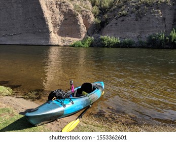 A Kayak On The Beach Near Mud Cliffs On The Lower Salt River Near Mesa Arizona.