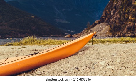 Kayak On Fjord Shore In Norwegian Tourist Destination Flam Village. Travel, Holidays And Active Lifestyle.