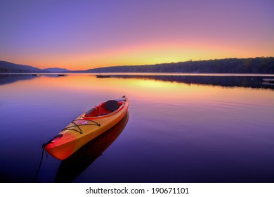 Kayak On Lake At Sunrise