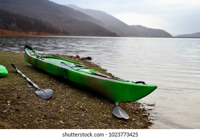 Kayak On A Peaceful Lake Beach