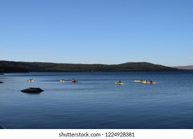 Kayak Riders Near The Trail Of West Thumb Geyser Basin, By West Thumb In The Yellowstone Lake, Near The Exit To The Grand Teton National Park, In Yellowstone National Park, USA