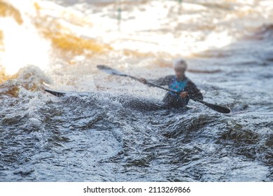 Kayak Slalom Canoe Race In White Water Rapid River, Process Of Kayaking Competition With Colorful Canoe Kayak Boat Paddling, Process Of Canoeing With Big Water Splash