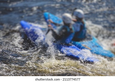 Kayak Slalom Canoe Race In White Water Rapid River, Process Of Kayaking Competition With Multiple Colorful Canoe Kayak Boat Paddling, Process Of Canoeing With Big Water Splash