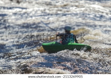 Kayak slalom canoe race in white water rapid river, process of kayaking competition with colorful canoe kayak boat paddling, process of canoeing with big water splash