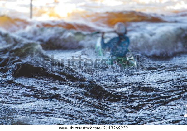Kayak slalom canoe race in\
white water rapid river, process of kayaking competition with\
colorful canoe kayak boat paddling, process of canoeing with big\
water splash