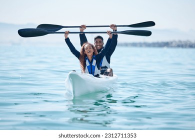 Kayak, sports and team celebrate win on rowing boat on a lake, ocean or river for fitness challenge. Man and woman or winning couple with a paddle for adventure, teamwork exercise or travel on water