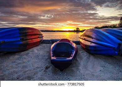 Kayak Sunrise Lake Scene. Kayaks Line A Sandy Lake Michigan Beach At Sunrise In Traverse City, Michigan.
