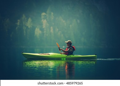 Kayak Tour On The Lake. Middle Age Caucasian Men In The Kayak On The Scenic Lake.