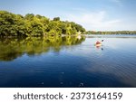 A Kayaker takes to the water on a warm October morning on a lake in Wisconsin.  Waukesha County Wisconsin