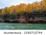 Kayakers make their way through the sea caves at the Apostle Islands National Lakeshore in Wisconsin