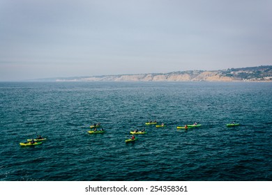 Kayakers in the Pacific Ocean, seen from La Jolla, California.