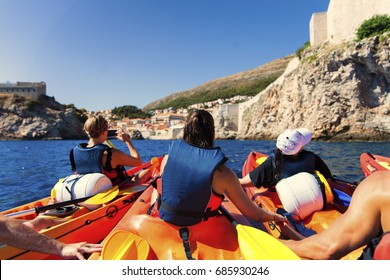 Kayaking Between Rocks On The Adriatic Sea In Dubrovnik 