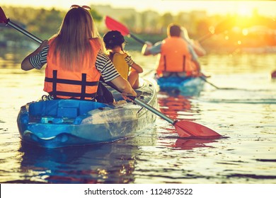 Kayaking And Canoeing With Family. Children On Canoe. Family On Kayak Ride.