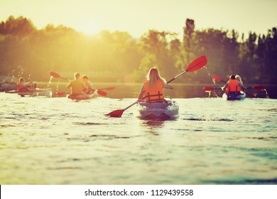 Kayaking and canoeing with family. Children on canoe. Family on kayak ride. - Shutterstock ID 1129439558