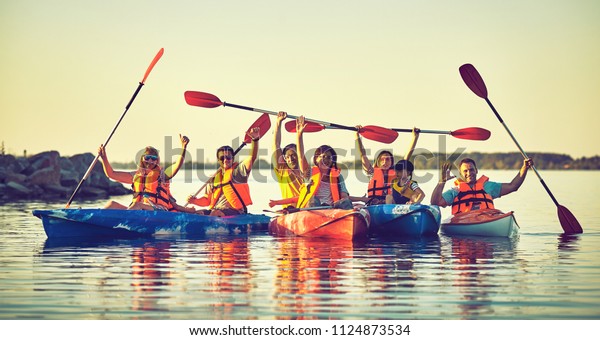 Kayaking and canoeing with family. Children on\
canoe. Family on kayak\
ride.