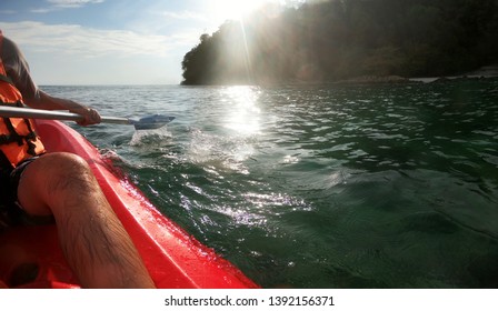 Kayaking. Close Up Of Man Holding Kayak Paddle At Sunset Sea