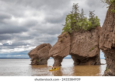 Kayaking at The flowerpot rock formations at Hopewell Rocks, Bay of Fundy, New Brunswick. The extreme tidal range of the bay makes them only accessible at low tide. - Powered by Shutterstock