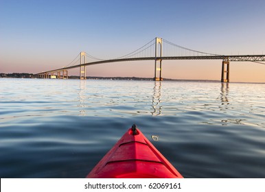 Kayaking towards The Pell Bridge at sunrise in Narragansett Bay off Newport,RI