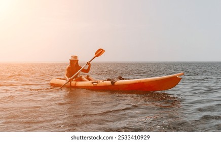 Kayaking, Water, Sunset - Woman paddling kayak on calm water at sunset. - Powered by Shutterstock