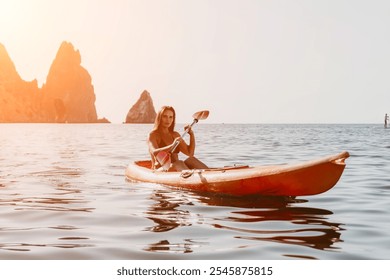 Kayaking Woman Sea Ocean Scenic View - Woman paddling a kayak on a calm ocean with rocky cliffs in the background. - Powered by Shutterstock