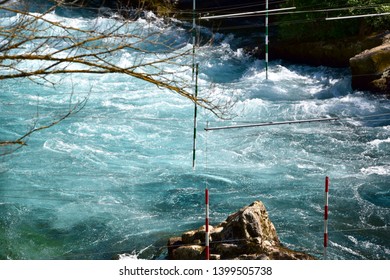 Kayaking/canoe Trail On A River With A Slalom Of Red Abd Green Poles Hanging On Wires Over The River In French Mountains