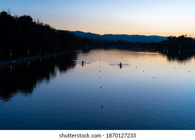 Kayaks racing in canal water reservoir for rowing sport practice on sunset vibrant background in Plovdiv, Bulgaria - Powered by Shutterstock