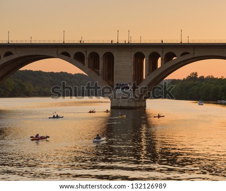 Kayaks Returning At Sunset On The Potomac River