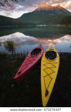 Kayaks in Whiteswan Lake Provincial Park with Flett Peak in the background. Rocky Mountains, Kootenay region, Canada