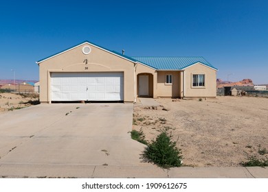 Kayenta, Arizona - July 17, 204:  The Facade Of A House With Garage And Driveway In A Neighbourhood In The Township Of Kayenta, In The Navajo County, State Of Arizona, USA.