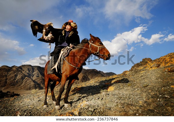 Kazakh men traditionally\
hunt foxes and wolves using trained golden eagles. Olgei,Western\
Mongolia.
