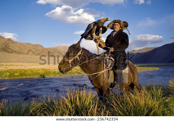 Kazakh men traditionally hunt foxes and wolves using\
trained golden eagles 