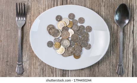 Kazakhstan tenge in a plate on the table.A lot of Kazakh money.Sawing the budget,the subsistence minimum or the dual currency basket in Kazakhstan.The crisis by the fall in exchange rates - Shutterstock ID 1794450244