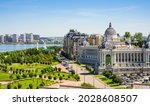 Kazan city in summer, Tatarstan, Russia. Panorama of park, river and Farmers Palace (Ministry of Environment and Agriculture) in Kazan center. Landscape of Kazan with building and sky. Travel theme.