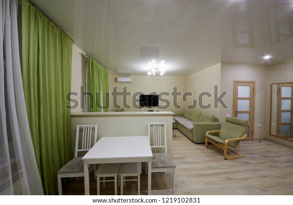 KAZAN, RUSSIA -\
DEC 7, 2017: Interior of modern room divided into kitchen and\
living zones in hotel Apartments on Bauman. Apartments located near\
Kazan Kremlin and Kul Sharif\
Mosque.