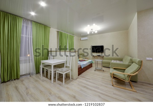 KAZAN, RUSSIA - DEC 7, 2017: Modern room\
divided into zones in hotel Apartments on Bauman. Apartments\
located near Kazan Kremlin and Kul Sharif\
Mosque.