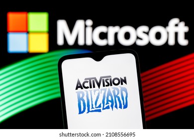 Kazan, Russia - Jan 18, 2022: Activision Blizzard logo on smartphone screen against  background of Microsoft logo. Microsoft announced buying of video game publisher Activision Blizzard.