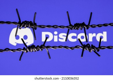 Kazan, Russia - Jan 20, 2022: Discord Social Gaming Platform Logo Behind Barbed Wire. The Concept Of Discord Censorship And Prohibition.