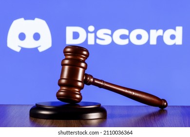 Kazan, Russia - Jan 20, 2022: Gavel On Table Against The Background Of Discord Social Gaming Platform Logo. The Concept Of The Trial.