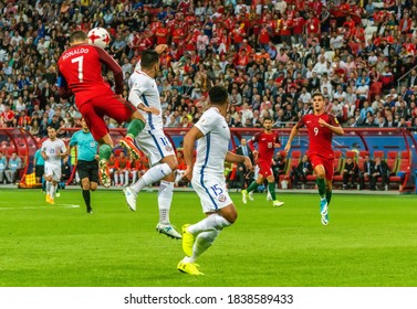 Kazan, Russia – June 28, 2017. Cristiano Ronaldo Performing A Header In Aerial With Chile Players Gonzalo Jara And Jean Beausejour During FIFA Confederations Cup 2017 Semi-final Portugal Vs Chile.