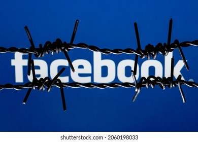 Kazan, Russia - Oct 19, 2021: Facebook Social Network Logo Behind Barbed Wire. The Concept Of Facebook Censorship And Prohibition.