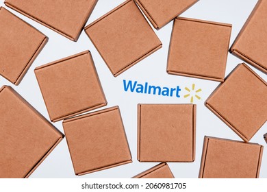 Kazan, Russia - Oct 20, 2021: Walmart is an American multinational retail corporation.  Walmart logo on a white background surrounded by parcel boxes.