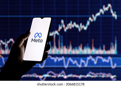 Kazan, Russia - Oct 31, 2021: Facebook changes its name to Meta. Smartphone with Meta logo on the background of stock chart. The shares will be traded from December 1 under the MVRS ticket.